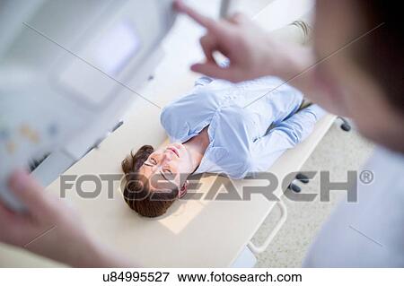 Stock Photo - Woman having X-ray.. Fotosearch
