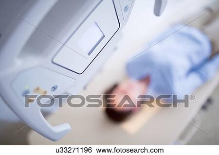 Woman having X-ray. View Large Photo Image Stock Photograph - Woman having X-ray.. Fotosearch