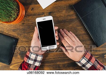 Stock Image - Woman using smartphone. Fotosearch
