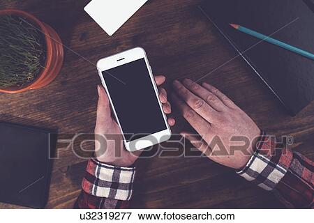 Stock Photo - Woman using smartphone. Fotosearch