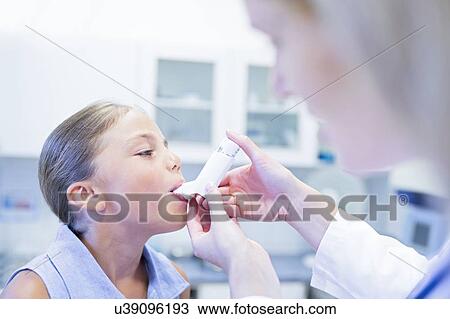 Young girl using an inhaler. View Large Photo Image Stock Image - Young girl using an inhaler.. Fotosearch