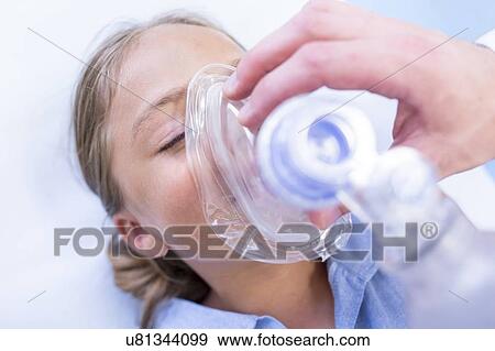 Stock Photo - Young girl with mask covering mouth.. Fotosearch