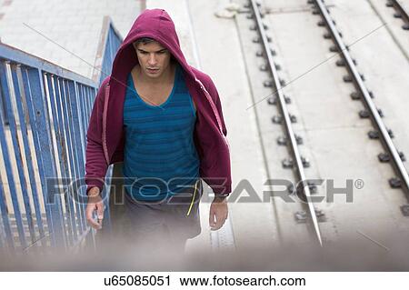 Young man wearing hooded top. View Large Photo Image Stock Image - Young man wearing hooded top.. Fotosearch