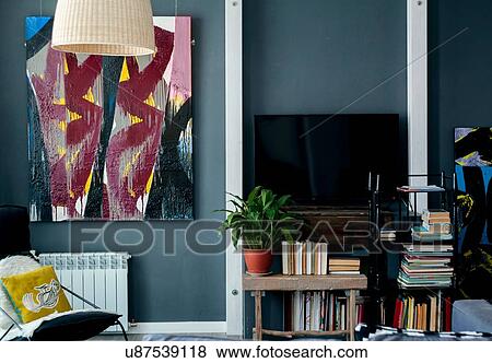 Abstract art and books in living room View Large Photo Image Stock Photo - Abstract art and books in living room. Fotosearch