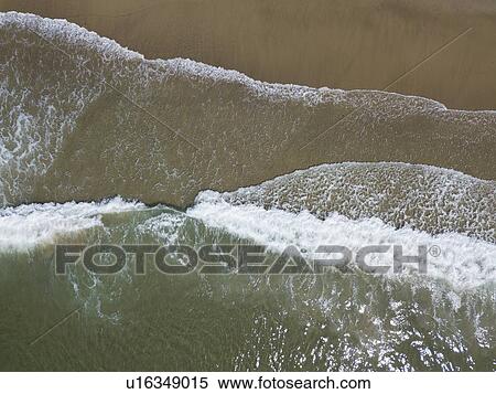 Aerial view of surfs on sea coast View Large Photo Image Stock Photography - Aerial view of surfs on sea coast. Fotosearch