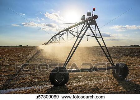 Agricultural irrigation of harvested wheat field. View Large Photo Image Stock Photo - Agricultural irrigation of harvested wheat field.. Fotosearch