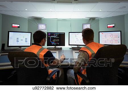 Apprentice engineers in industrial production facility training View Large Photo Image Stock Image - Apprentice engineers in industrial production facility training. Fotosearch