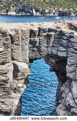 Stock Photo - Arched rock formation in sea, Tarrafal, Cape Verde, Africa. Fotosearch