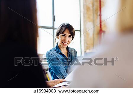 Stock Image - Architect at meeting. Fotosearch