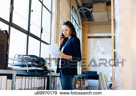 Architect reading by filing shelves View Large Photo Image Stock Photo - Architect reading by filing shelves. Fotosearch