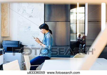 Stock Photo - Architect using mobile phone. Fotosearch