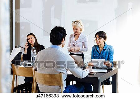 Stock Image - Architects at brainstorming meeting. Fotosearch