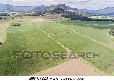 Stock Image - Australia, Landscape with fields and Kangaroo Valley in distance. Fotosearch