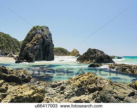 Stock Image - Australia, New South Wales, Bermagui, Clear sky above coastline. Fotosearch