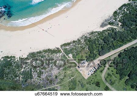 Stock Photo - Australia, New South Wales, Bermagui, Landscape with beach. Fotosearch