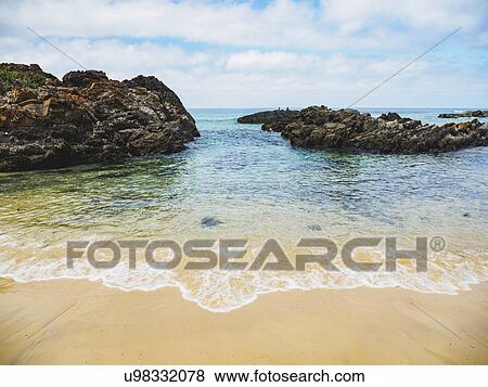 Australia, New South Wales, Bermagui, Scenic view of sea and rock formation View Large Photo Image Stock Photo - Australia, New South Wales, Bermagui, Scenic view of sea and rock formation. Fotosearch