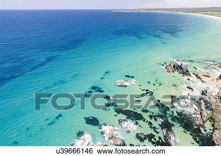 Stock Photograph - Australia, New South Wales, Bermagui, Seascape and beach. Fotosearch