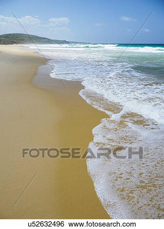 Stock Photograph - Australia, New South Wales, Bermagui, Scenic view of sea and sandy beach. Fotosearch