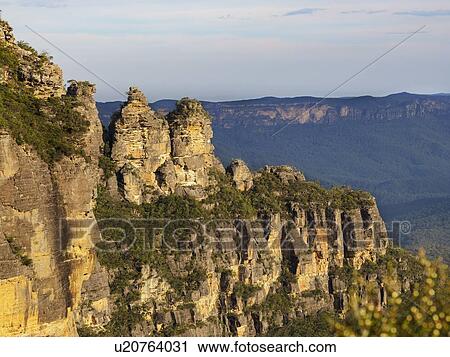 Stock Image - Australia, New South Wales, Blue Mountains, Storm clouds above Three Sisters. Fotosearch