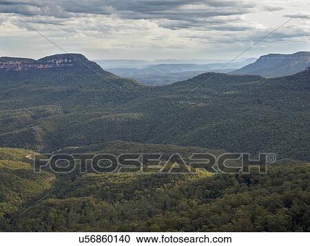 Stock Image - Australia, New South Wales, Jamison Valley, Storm clouds above Blue Mountains. Fotosearch