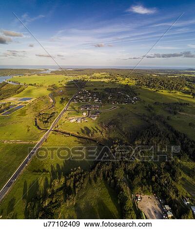 Stock Photo - Australia, New South Wales, Moruya, Landscape with town and river. Fotosearch