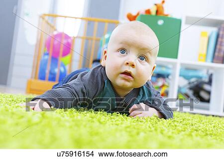 Picture - Baby boy crawling.. Fotosearch