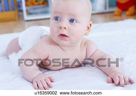 Stock Image - Baby boy crawling.. Fotosearch