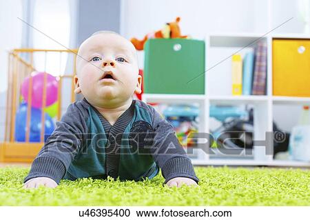 Stock Image - Baby boy crawling.. Fotosearch