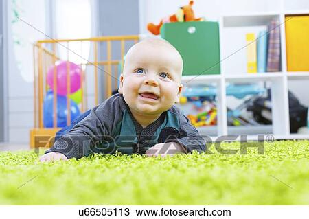 Stock Image - Baby boy crawling.. Fotosearch