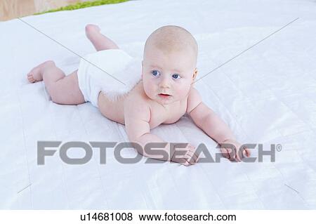 Stock Photo - Baby boy crawling.. Fotosearch