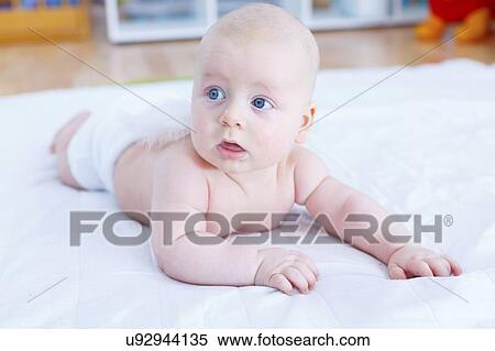 Stock Photography - Baby boy crawling.. Fotosearch