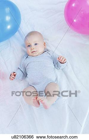 Baby boy lying on back. View Large Photo Image Stock Photograph - Baby boy lying on back.. Fotosearch