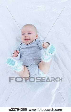 Baby boy lying on back. View Large Photo Image Stock Photography - Baby boy lying on back.. Fotosearch