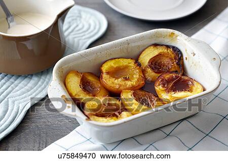 Baked nectarines in white dish, close-up View Large Photo Image Stock Image - Baked nectarines in white dish, close-up. Fotosearch