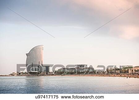 Stock Photography - Beach with Hotel W in background, Barcelona, Catalonia, Spain. Fotosearch