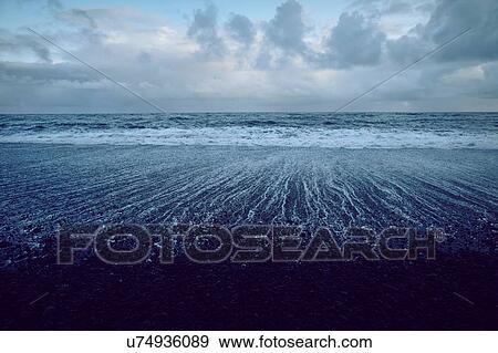 Stock Photo - Black sand beach, Akureyri, Eyjafjardarsysla, Iceland. Fotosearch