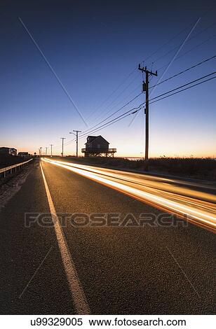 Blurred headlight of car on road at dawn View Large Photo Image Stock Photography - Blurred headlight of car on road at dawn. Fotosearch