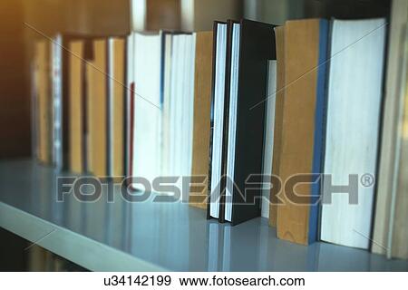 Books on library shelf through window. View Large Photo Image Stock Photo - Books on library shelf through window.. Fotosearch