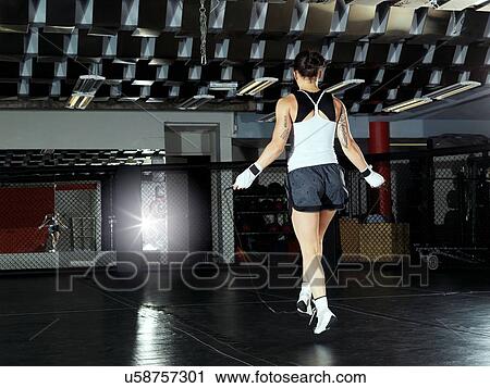 Stock Image - Boxer training in gym. Fotosearch