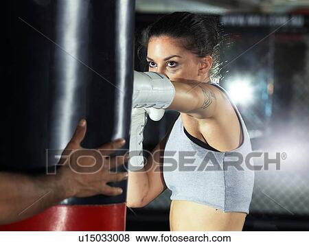 Stock Photo - Boxer training in gym. Fotosearch