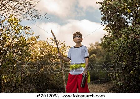 Boy exploring in woodlands, Thousand Oaks, California, US View Large Photo Image Stock Photo - Boy exploring in woodlands, Thousand Oaks, California, US. Fotosearch