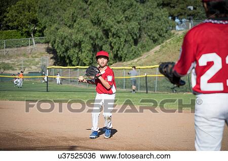 Stock Photograph - Boys practising baseball. Fotosearch