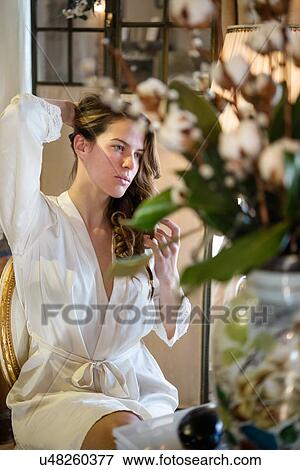 Stock Photo - Bride in dressing gown on morning of wedding. Fotosearch