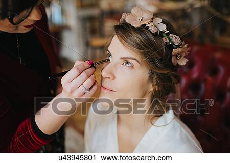 Bride preparing for wedding with make-up artist View Large Photo Image Stock Image - Bride preparing for wedding with make-up artist. Fotosearch