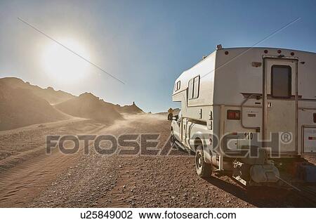 Stock Image - Campervan parked on desert dirt track, San Pedro de Atacama, Chile. Fotosearch