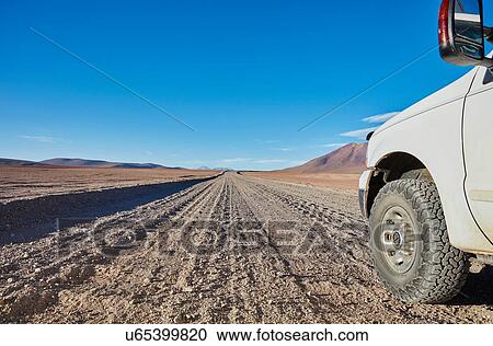 Stock Image - Campervan parked on desert dirt track, San Pedro de Atacama, Chile. Fotosearch