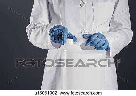 Chemist opening white plastic canister. View Large Photo Image Stock Image - Chemist opening white plastic canister.. Fotosearch