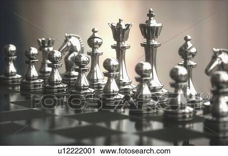 Stock Image - Chess pieces on board, close up.. Fotosearch