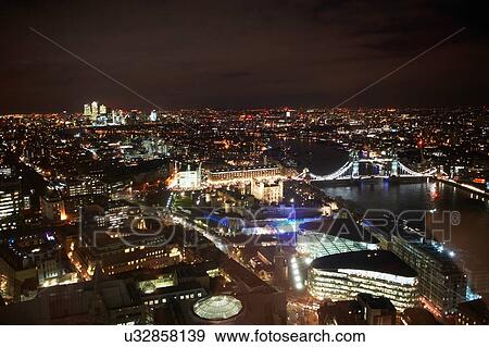 Cityscape of London and river Thames illuminated at night, United Kingdom, Europe View Large Photo Image Stock Photo - Cityscape of London and river Thames illuminated at night, United Kingdom, Europe. Fotosearch