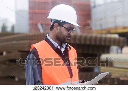 Civil engineer working at site View Large Photo Image Stock Image - Civil engineer working at site. Fotosearch